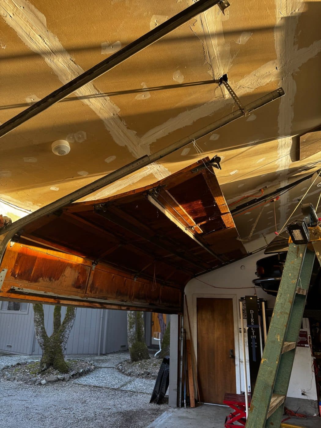 Off-track wood door, put back on track — before